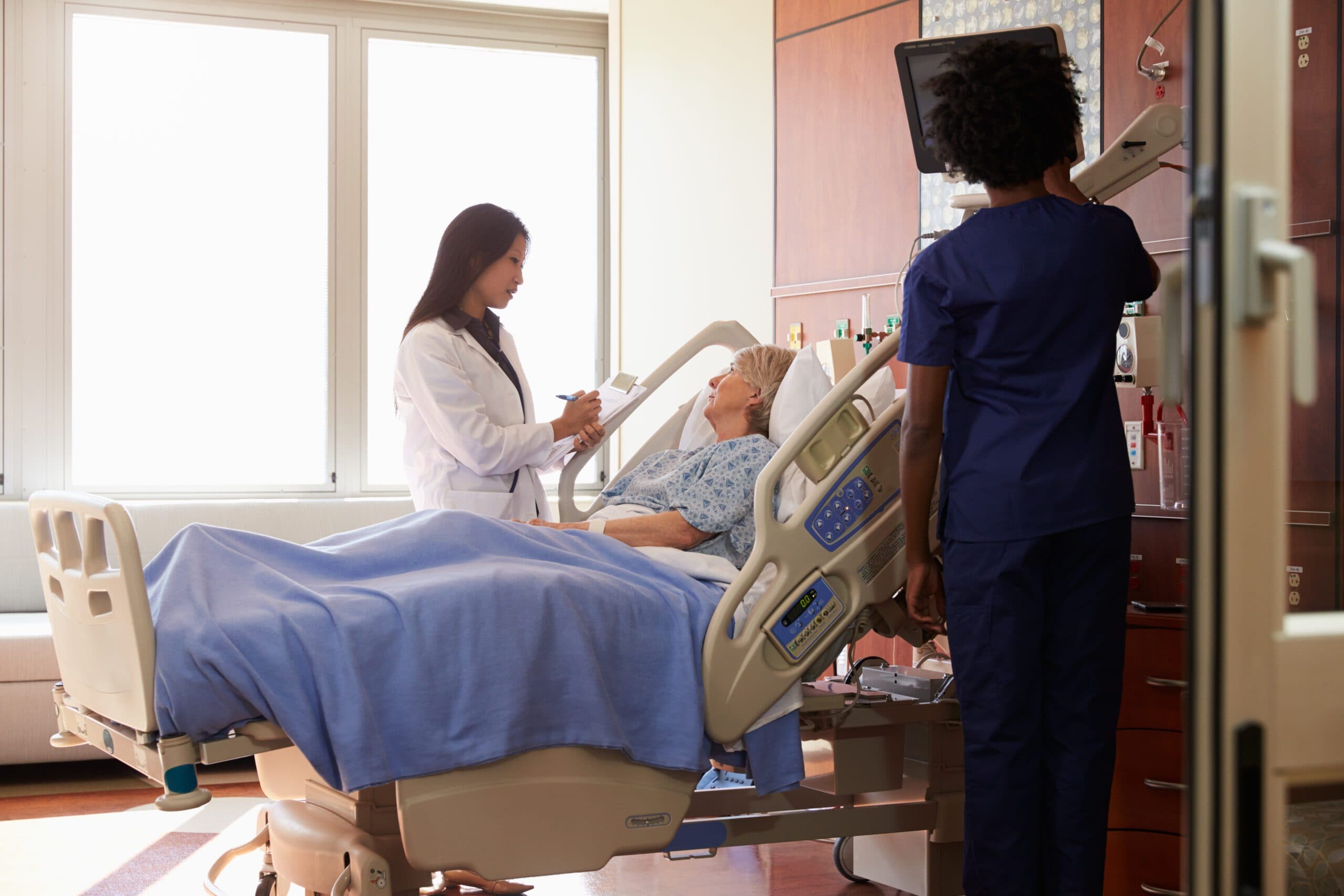 Doctor and nurse helping a patient in a hospital